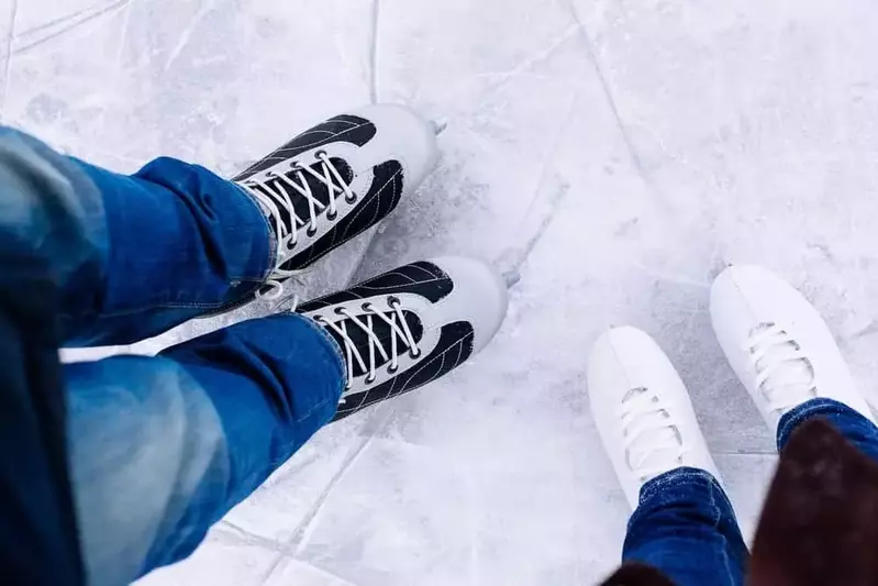 close up on a couple's ice skates
