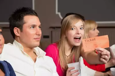 woman showing ticket to Gatlinburg attraction