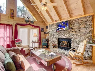 cabin living room with stone fireplace
