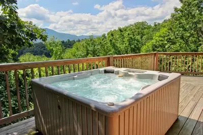 Hot tub on the deck of Perfect Pointe of View, one of our rental cabins in Gatlinburg TN.