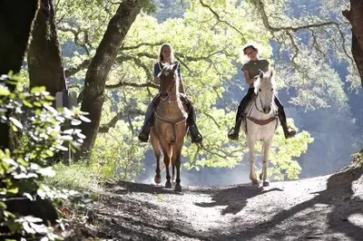 2 women enjoying horseback riding in gatlinburg