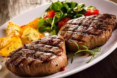 Delicious steaks with vegetables.
