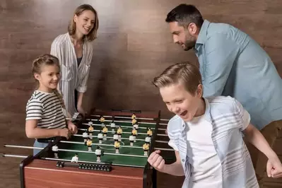 family playing foosball