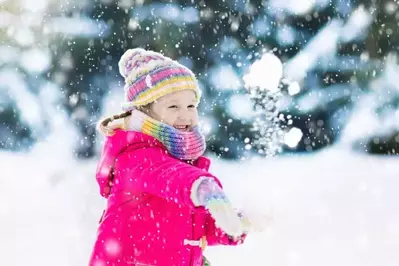 girl throwing a snowball