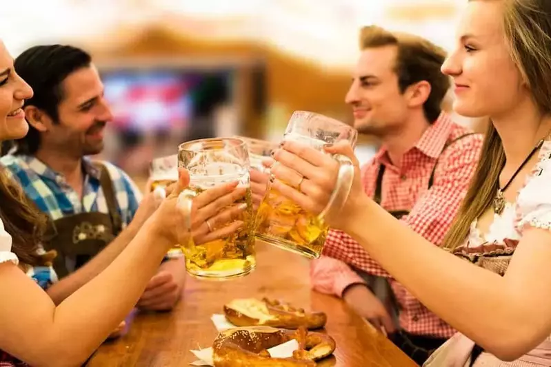 Friends having fun at an Oktoberfest celebration.