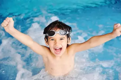 kid having fun at Smoky Mountain cabin rentals with indoor pool