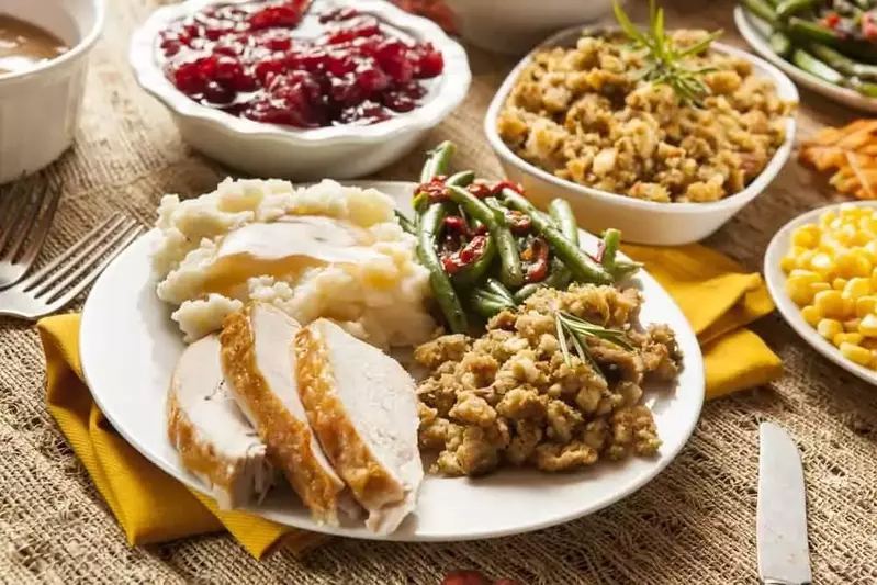 A table filled with delicious Thanksgiving food.