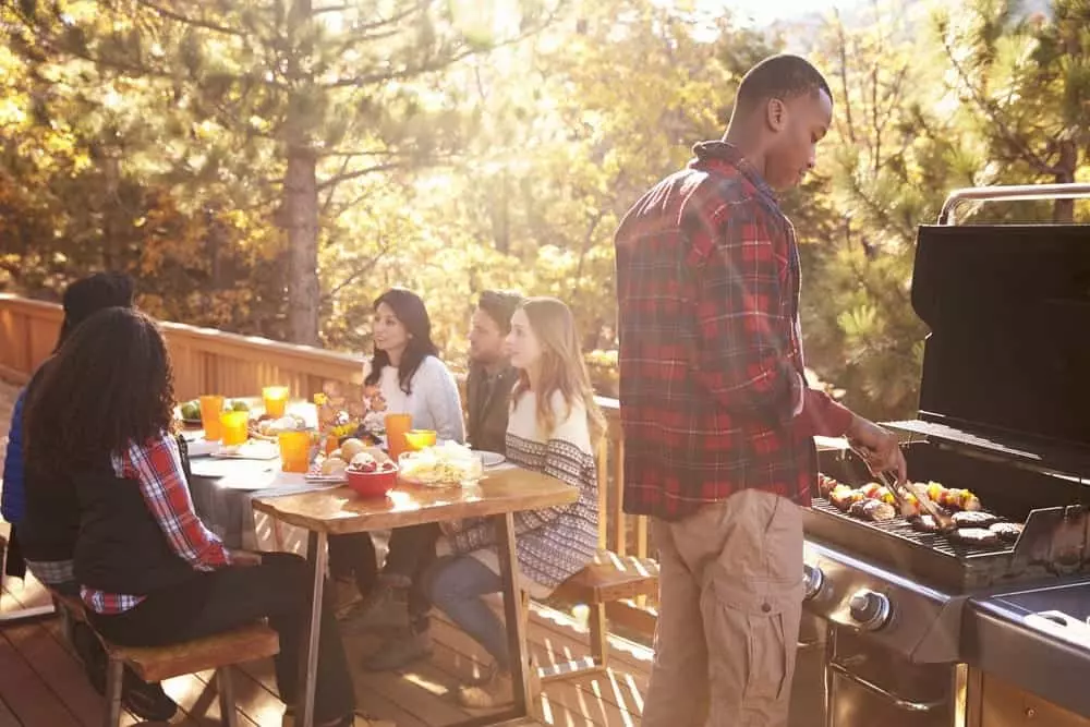 Friends having a cookout on the deck.