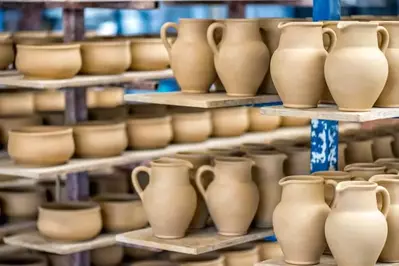 Pots on shelves in a store.