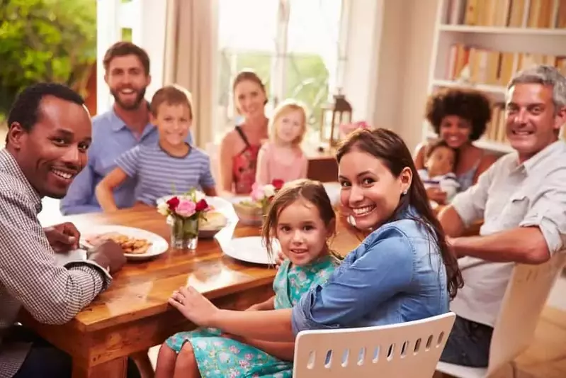 family sitting down to dinner together