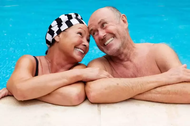 happy older couple in Smoky Mountain cabin rentals with indoor pool