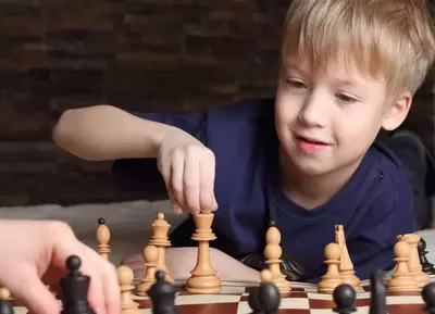 Child playing Gatlinburg family activtiies of playing board games