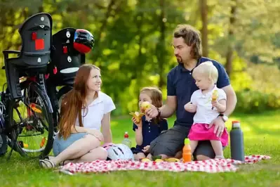 Happy family having a picnic near our Gatlinburg TN mountain cabins.